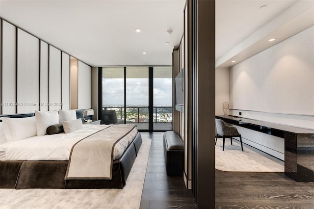 bedroom featuring access to outside, wood-type flooring, and expansive windows