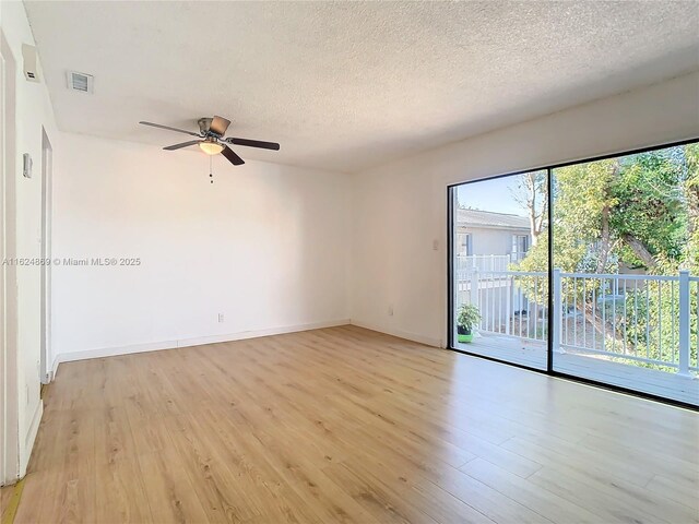 kitchen with washer and clothes dryer and light brown cabinets