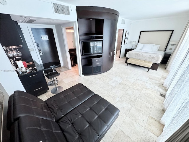 tiled living room featuring ornamental molding