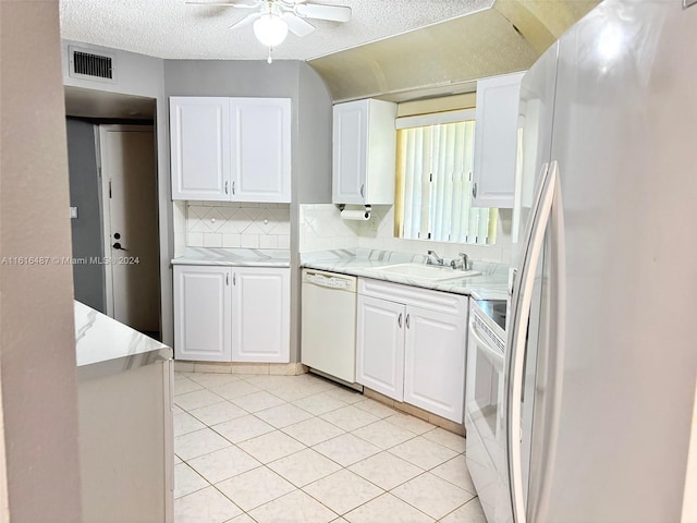 kitchen featuring white cabinetry, white appliances, ceiling fan, decorative backsplash, and sink