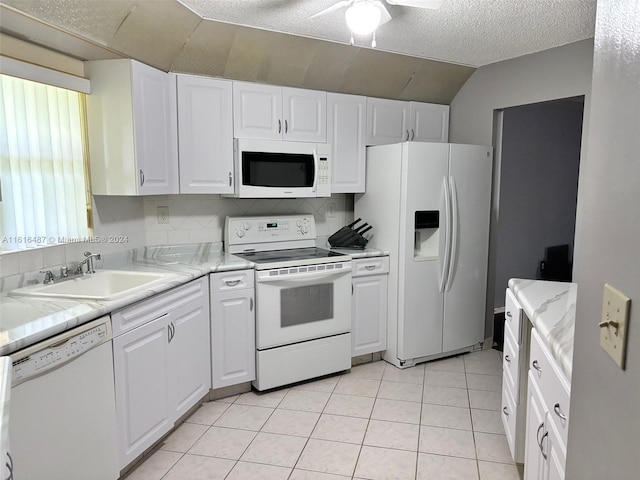 kitchen with white cabinetry, light tile patterned floors, ceiling fan, and white appliances