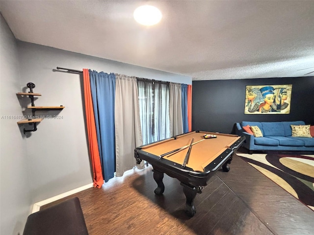 game room featuring pool table, hardwood / wood-style floors, and a textured ceiling