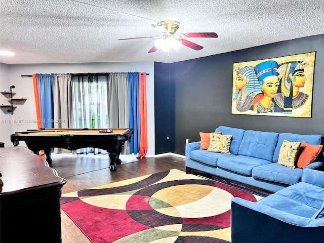 living room with a textured ceiling, ceiling fan, hardwood / wood-style floors, and billiards