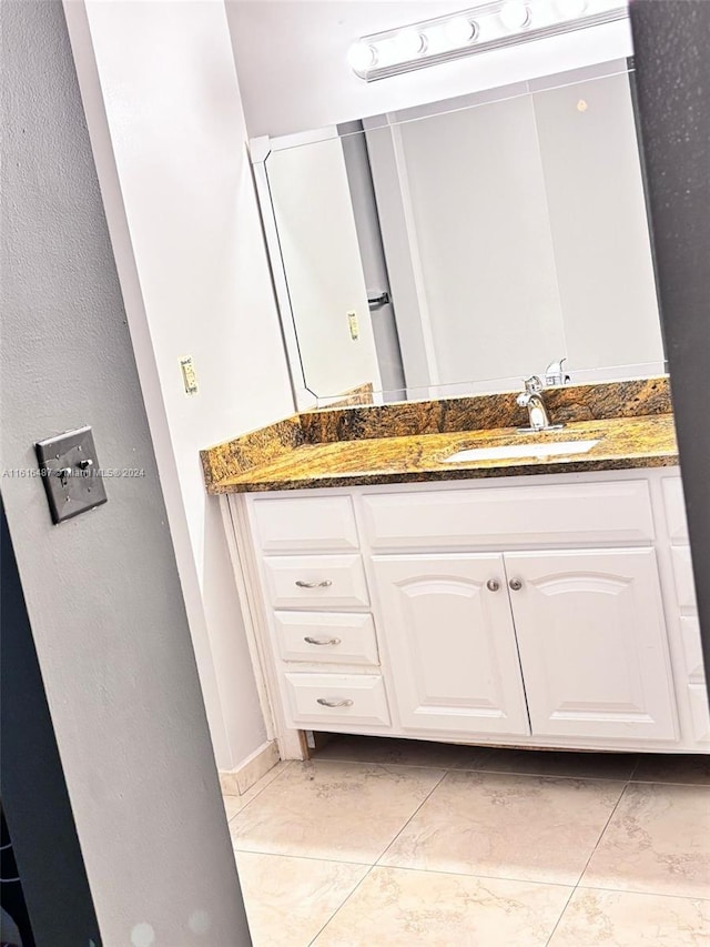 bathroom featuring tile patterned floors and vanity