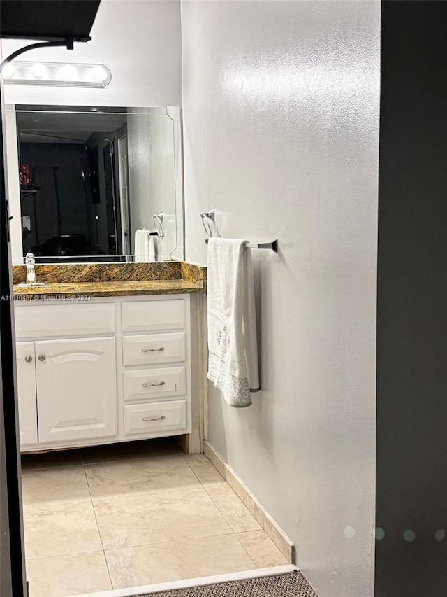 bathroom with vanity and tile patterned floors