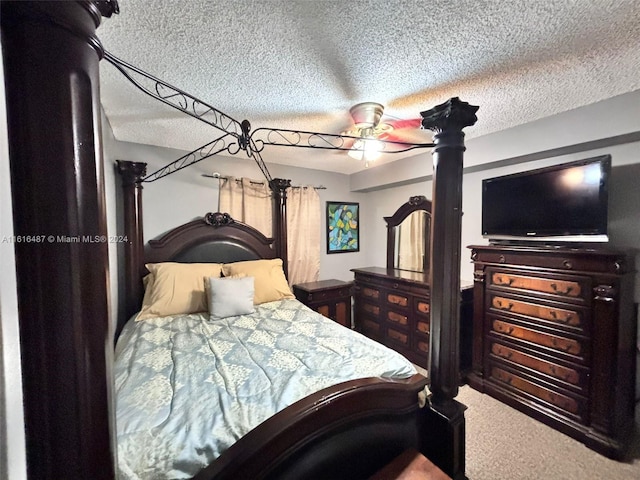 bedroom featuring ceiling fan, carpet flooring, and a textured ceiling