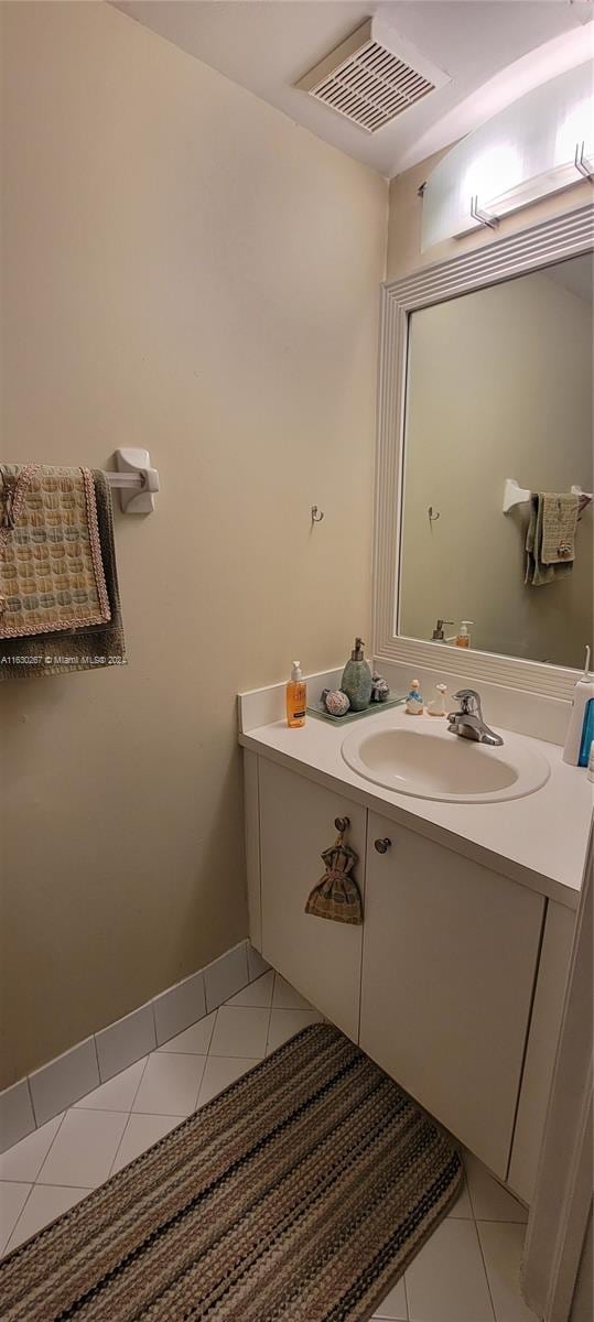 bathroom featuring vanity and tile patterned flooring