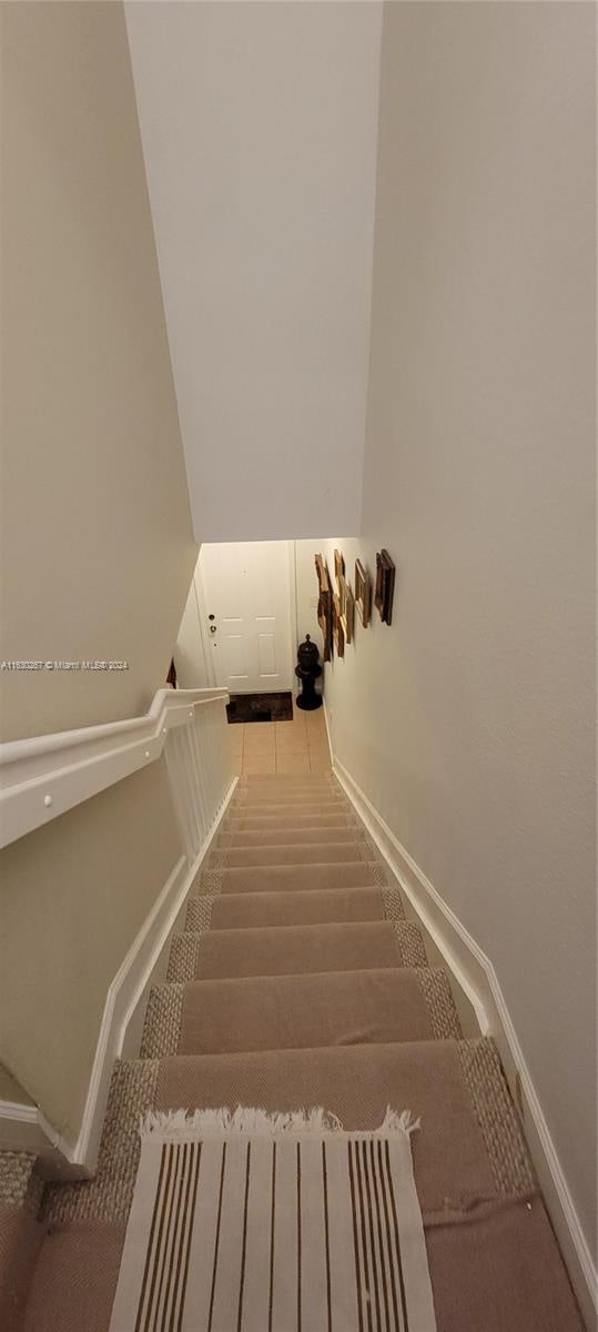 stairs featuring carpet