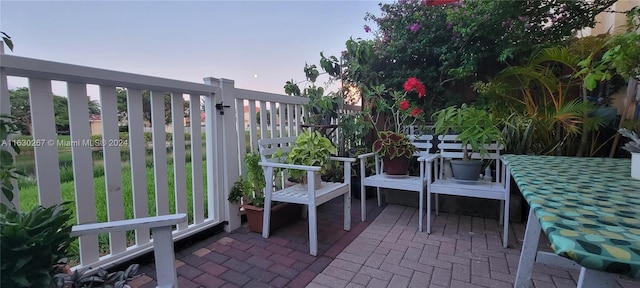 view of balcony at dusk