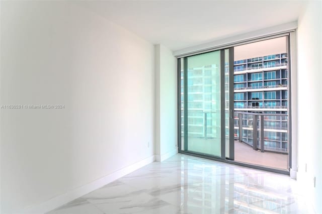 empty room with floor to ceiling windows