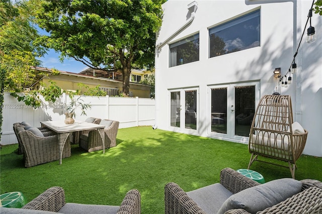 view of yard with french doors