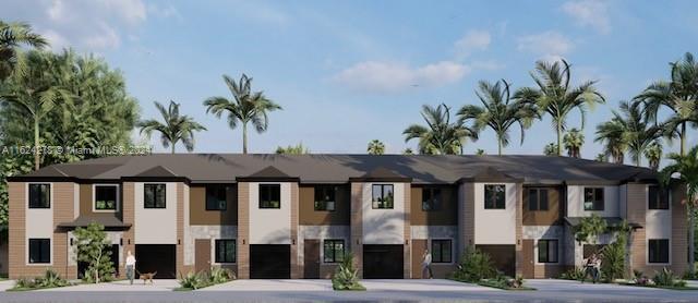 866 SW 1st St, Florida City, FL 33034 - view of building exterior with concrete driveway and an attached garage