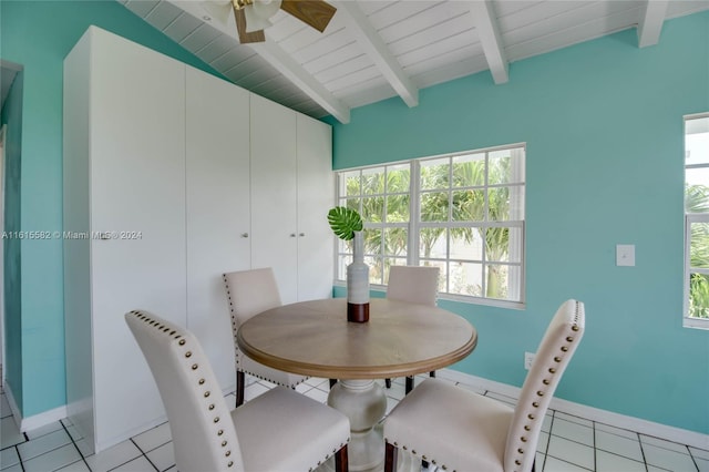 tiled dining area featuring beamed ceiling, ceiling fan, and wood ceiling