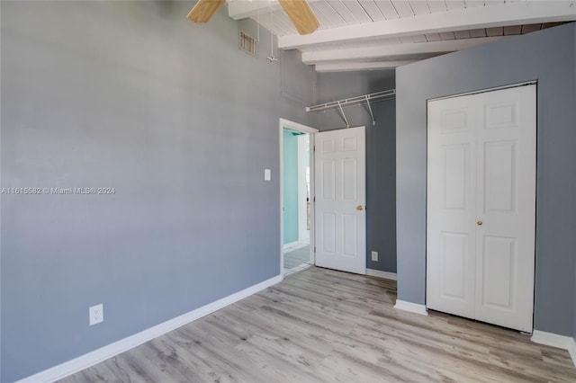 unfurnished bedroom with high vaulted ceiling, ceiling fan, wood ceiling, beam ceiling, and light hardwood / wood-style flooring