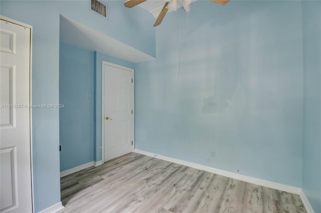 spare room featuring light hardwood / wood-style flooring and ceiling fan