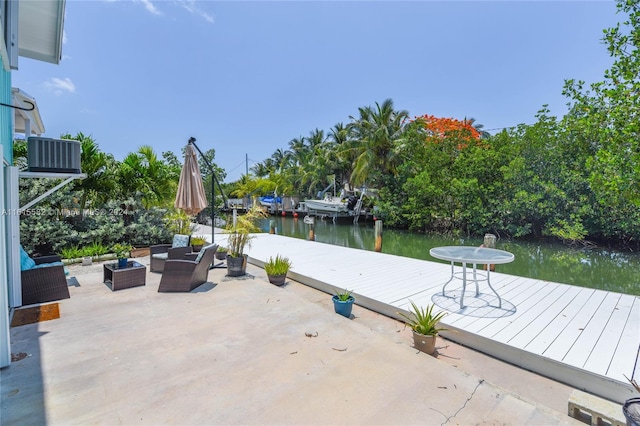 view of patio / terrace with a water view, an outdoor hangout area, a boat dock, and central AC unit