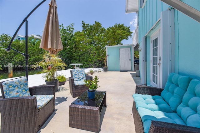 view of patio featuring an outdoor living space and french doors