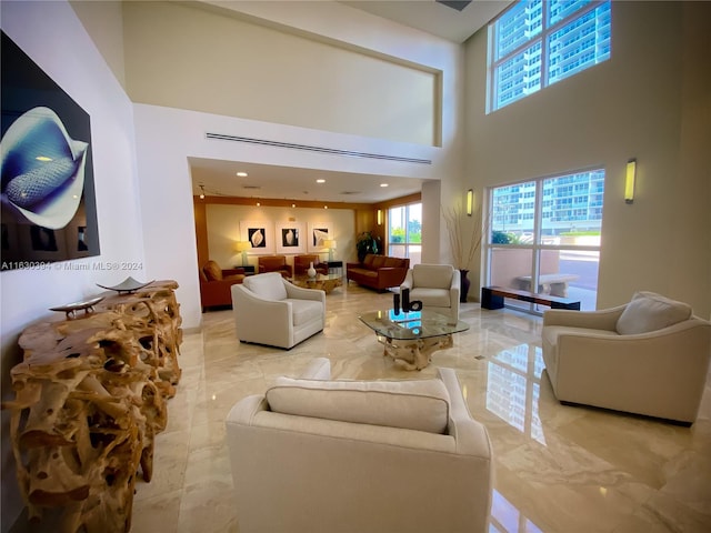 living room featuring a towering ceiling