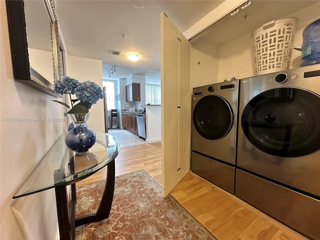 2080 S Ocean Dr Unit 701, Hallandale Beach, FL 33009 - clothes washing area featuring light wood finished floors and washing machine and dryer