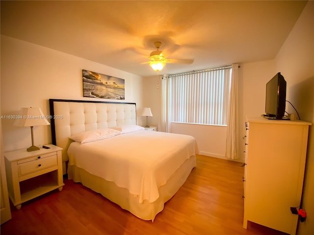 bedroom featuring ceiling fan and light wood-style flooring