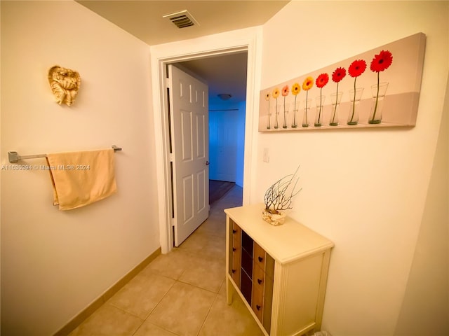 hallway with light tile patterned floors