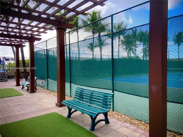 view of patio featuring fence and a pergola