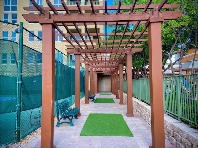 view of patio featuring fence and a pergola