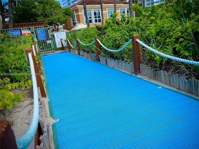 view of swimming pool with fence