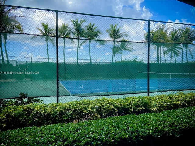 view of sport court with fence