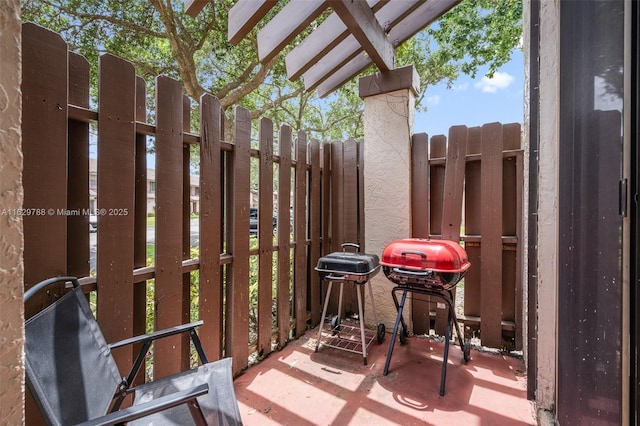 view of patio featuring a grill