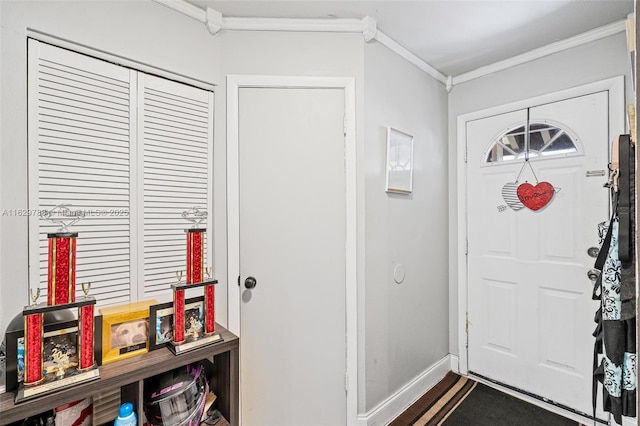 foyer with ornamental molding and wood-type flooring