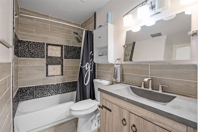 full bathroom with tile walls, tasteful backsplash, toilet, shower / bath combination with curtain, and vanity