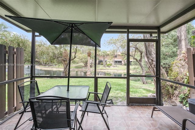 sunroom with a water view