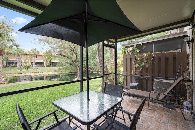 view of patio with a water view