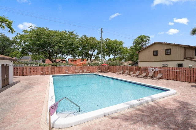 view of pool featuring a patio area