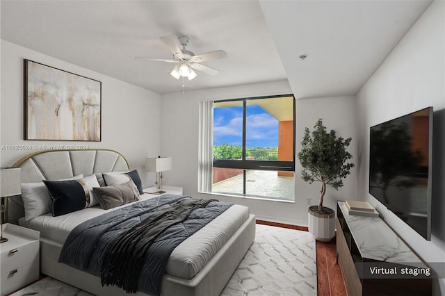 bedroom featuring ceiling fan and light hardwood / wood-style floors