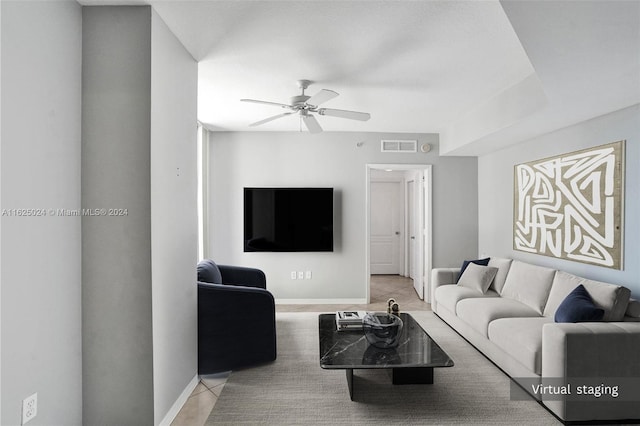 living room with light tile patterned floors and ceiling fan