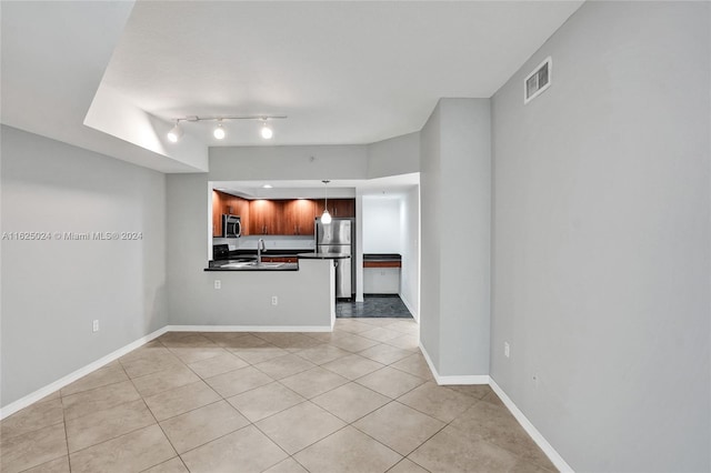 unfurnished living room with light tile patterned floors