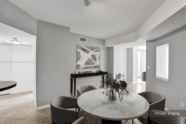 dining space with light tile patterned flooring