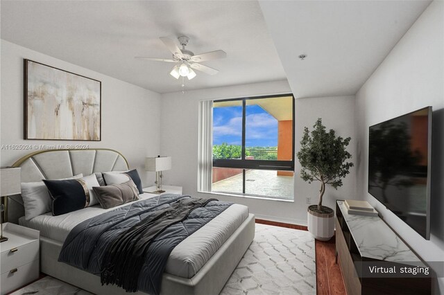 bedroom featuring ceiling fan and light hardwood / wood-style flooring