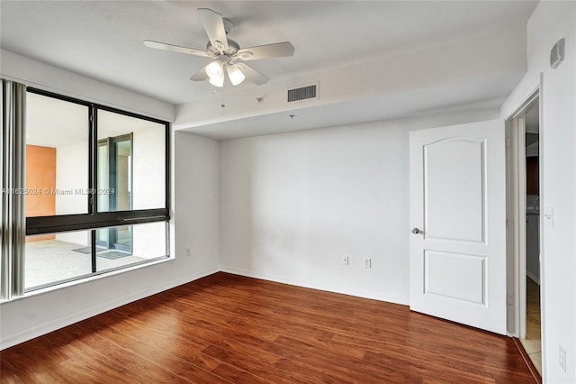 unfurnished room with ceiling fan and wood-type flooring