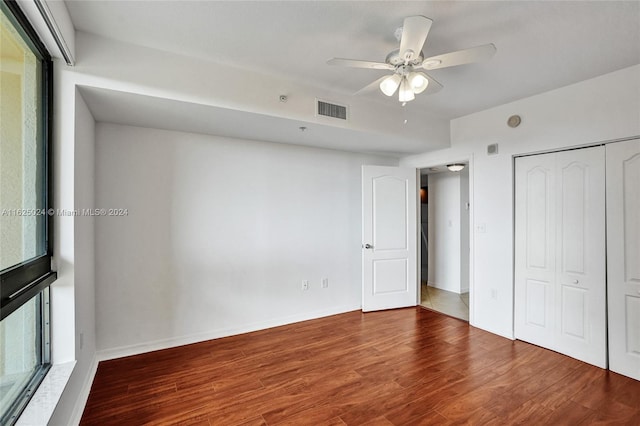 unfurnished bedroom featuring a closet, ceiling fan, and hardwood / wood-style floors