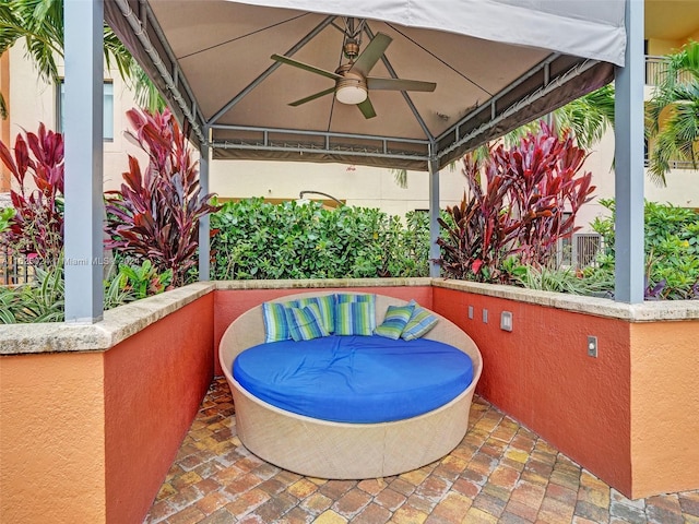 view of patio featuring ceiling fan