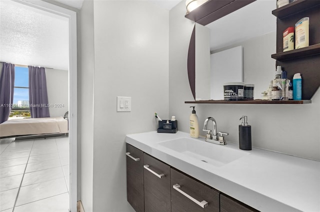 bathroom with tile patterned flooring and vanity