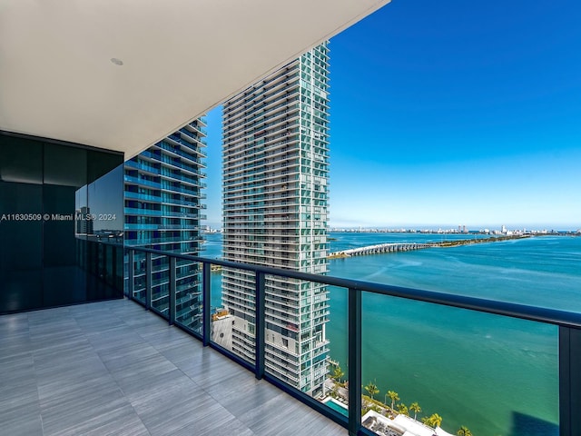 balcony featuring a water view