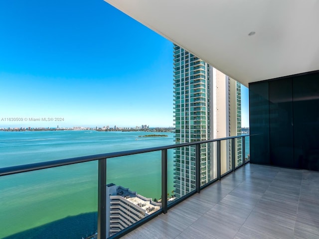 balcony featuring a water view