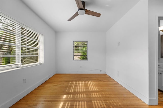 empty room featuring ceiling fan and light hardwood / wood-style floors