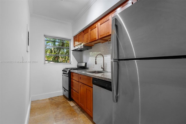 kitchen with decorative backsplash, ornamental molding, sink, appliances with stainless steel finishes, and light tile patterned floors