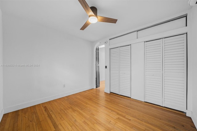 unfurnished bedroom featuring light wood-type flooring and ceiling fan