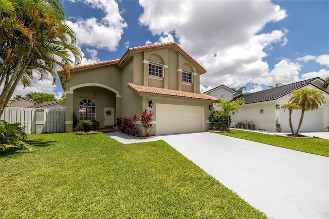 mediterranean / spanish house with a garage and a front lawn